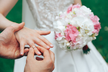 Obraz na płótnie Canvas .Wedding bouquet in the hands of the bride