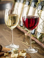 Glasses of wine and cheese plate.