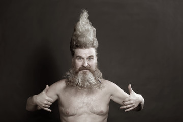 adult man with a beard and high mohawk