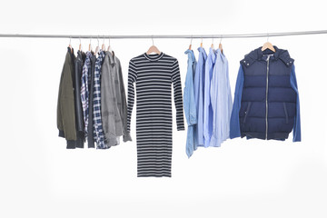 Set shirts ,clothing on hangers on a white background