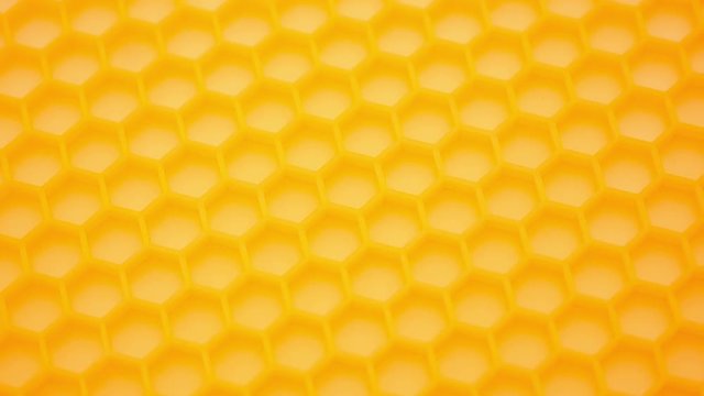Abstract background. Fragment of honeycomb plastic imitation.