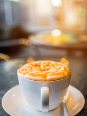 Cup of cappuccino in coffee ship 