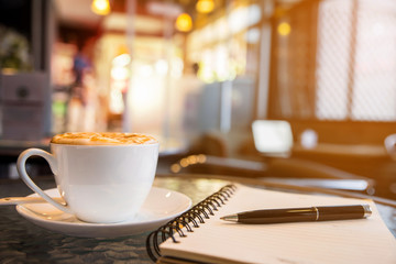 Cup of cappuccino in coffee ship 