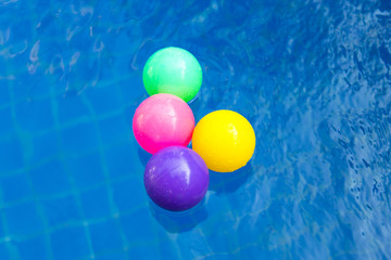 Colorful plastic balls in pool , pool villa house.