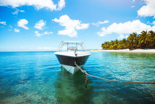 Sailing boat on crystal blue water of ocean. Tropical scene. Amazing landscape. Summer vacation concept.