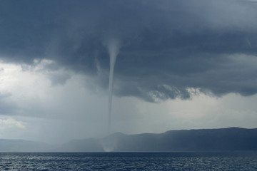 small tornado over the sea