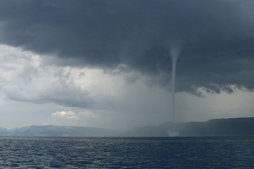 Naklejka premium small tornado over the sea