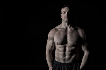 Fototapeta na wymiar handsome bodybuilder man with muscular body training in gym