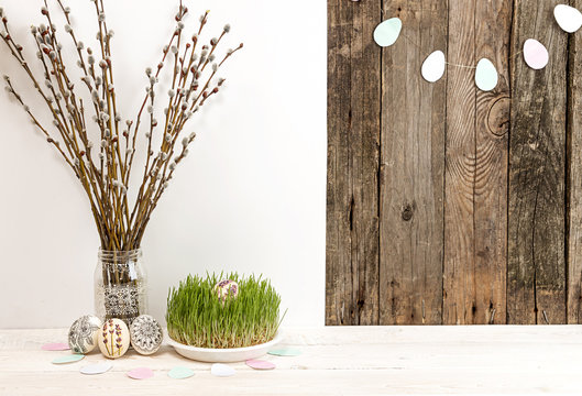 Easter holiday background with willow branch, painted Easter eggs