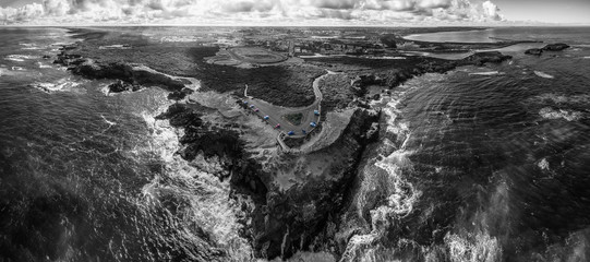 Black and white aerial panorama of Thunder Point lookout and Warrnambool, Victoria, Australia