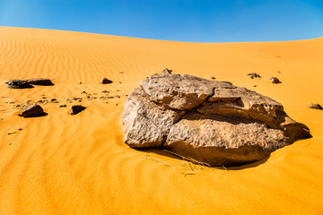 Fototapeta na wymiar Beautiful Moroccan landscape, Sahara desert, rock against the sky