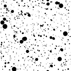Seamless pattern with black ink or paint spots, drips and splashes texture on white background. Grunge wallpaper.