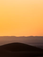 Beautiful sunset over the sand dunes in the Sahara desert, Morocco