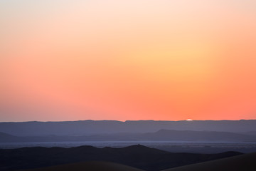 Beautiful sunset over the sand dunes in the Sahara desert, Morocco