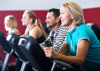 People training on exercise bikes together