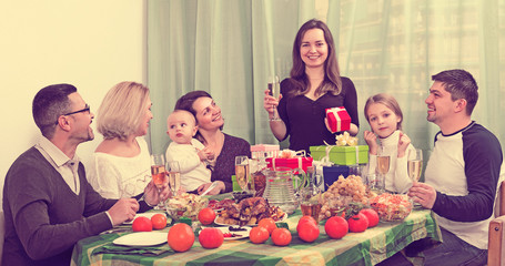 Smiling woman celebrating  with  family