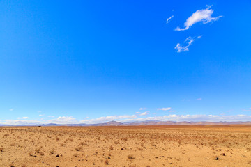 Obraz na płótnie Canvas Beautiful Moroccan landscape, Sahara desert, stones against the sky