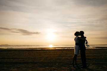 Romantic couple on a sunset background