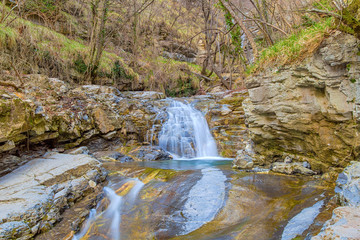 Waterfall in the forest, Genoa province, Italy