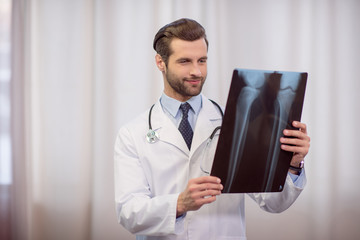 Doctor holding x-ray image