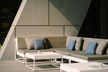 Luxury Grey sofa and and blue Pillow. Scandinavian interior design.