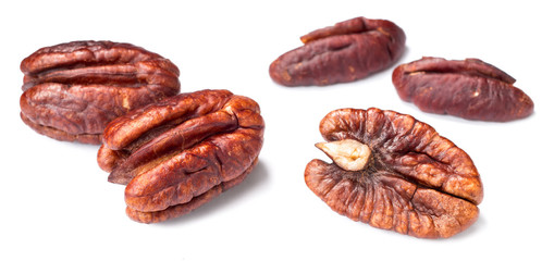 roasted pecan fruits on white, (large depth of field, taken with tilt shift lens)