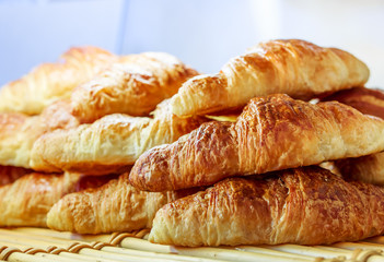 closeup on croissants with butter in french pastry shop