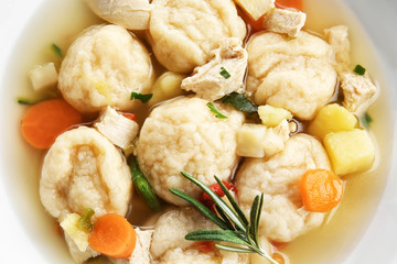 White plate of delicious chicken and dumplings closeup