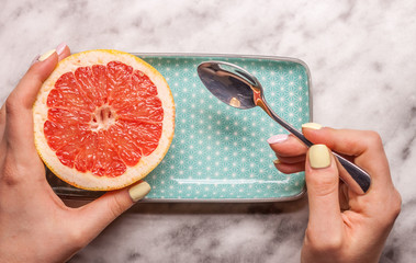 red grapefruit rectangular plate and spoon