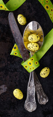 Easter table setting Cutlery,painted eggs,ribbon.selective focus.
