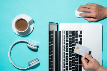 Top view of male hands making online payment
