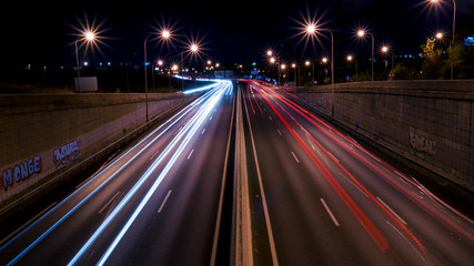 Highway with light trails of cars at night