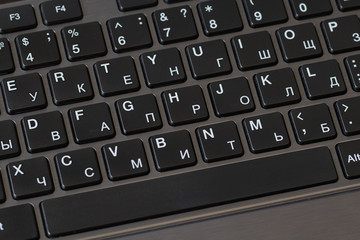 Black keyboard of laptop closeup. Business or education concept
