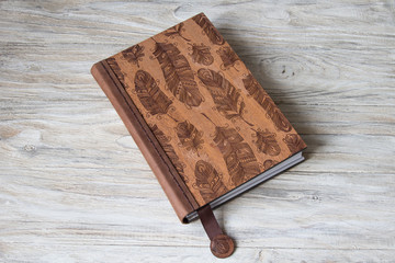 Blank notebook on a wooden background