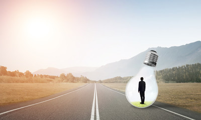 Businessman inside light bulb