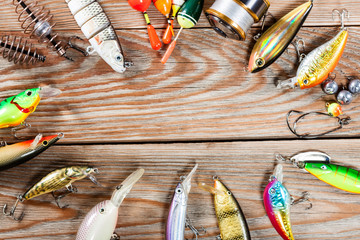 Fishing accessories on a wooden background. © Alex Ishchenko