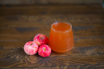 Delicious fresh squeezed apple juice in  transparent glass