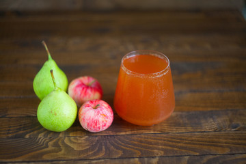 Delicious fresh squeezed Apple-pear juice in  transparent glass