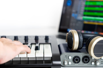 Obraz na płótnie Canvas Musician is recording Portable Computer Music Studio home set up