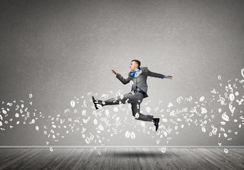 Businessman jumping high