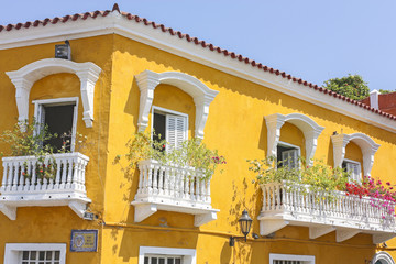 Detail of a colonial house. balcony with flowers and plants. Cartagena de Indias. Colombia.