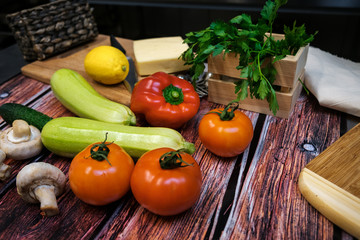 Fresh vegetables on a wooden table lie