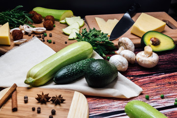 Fresh vegetables on a wooden table lie