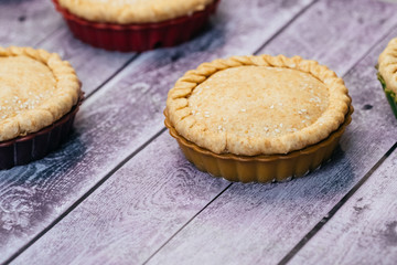 Healthy pie of a round shape on a wooden table
