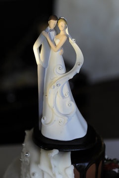 Close up of romantic and delicate wedding cake topper