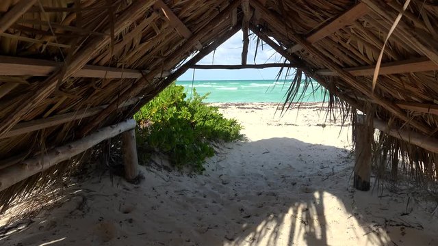 View of the sea through a shadow hut at the Playa Las Gaviotas beach. Cayo Santa Maria, Villa Clara, Cuba