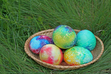 Colorful easter eggs in basket