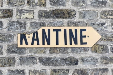 sign kantine - canteen - at an old brick wall