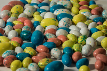 Fototapeta na wymiar Cluster of multi-colored candy easter eggs
