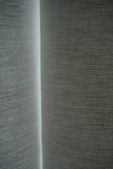 abstract light behind linen curtain 